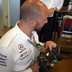 amg mercedes petronas team member explains f1 steering wheel.JPG